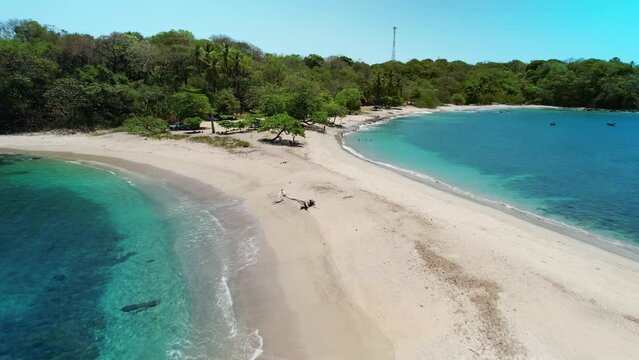 Drone Flight Across Popular Sandy San Juanillo Beach Shore With Blue Ocean Both Sides Of Coast, Costa Rica 4K