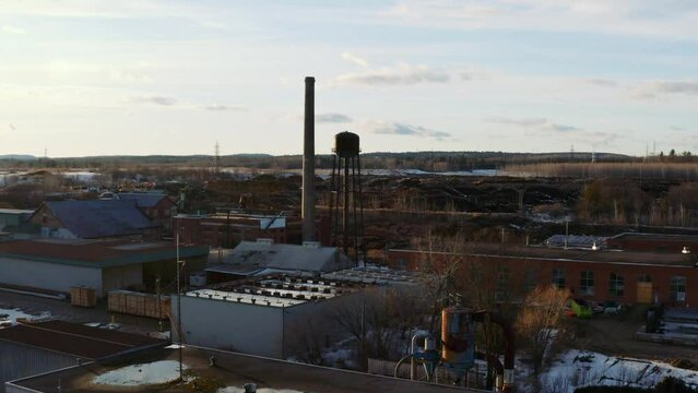 Dolly forward shot of an abandoned industrial complex formerly used for pulp and paper production in Thurso Quebec Canada