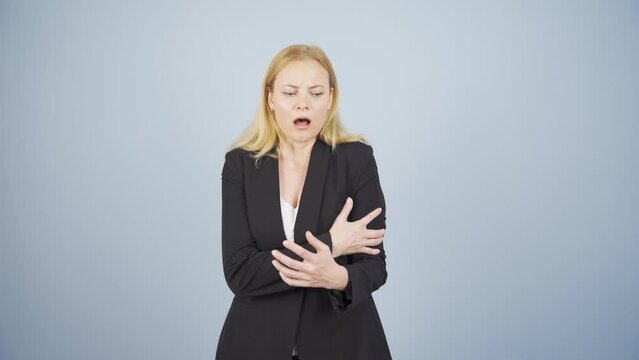Business woman having a heart attack.