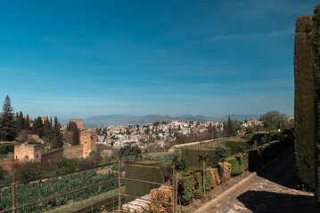 Fototapeta na wymiar Granada,Spain. April 17, 2022: Architecture and facade of the Generalife Palace with beautiful blue sky.