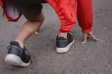 Runners use starting blocks to start their run around the stadium