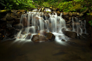 Obraz premium Landscape of multilevel waterfalls in Dlundung, Trawas, Mojokerto. Indonesia.