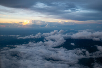 Obraz premium Surreal View of Various Types of Majestic, Colorful Clouds at Twilight From an Airplane Window over Costa Rica