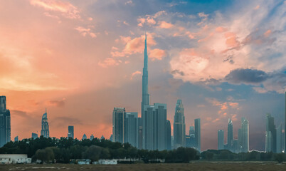 View at sunset from the window of a tourist bus on the architecture of the city of Dubai, United Arab Emirates