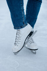 Young woman skating. Winter. Rink