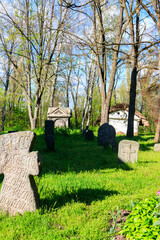Naklejka premium Old stone gravestones in the old abandoned cemetery