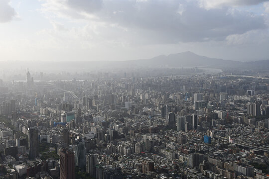 Aerial view of a beautiful city from the roof of Taipei 101 on a cloudy day in Taiwan