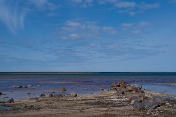 Beautiful landscape. Empty Kardla beach (Estonian - Kärdla rand) on a sunny spring day. Selective focus, blurred background.