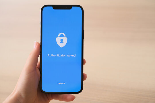 Hand holds smartphone with Microsoft Authenticator app logo on November 4, 2021 in Sofia, Bulgaria.