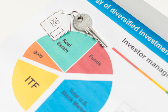 keys and stack of dollars isolated on a white background