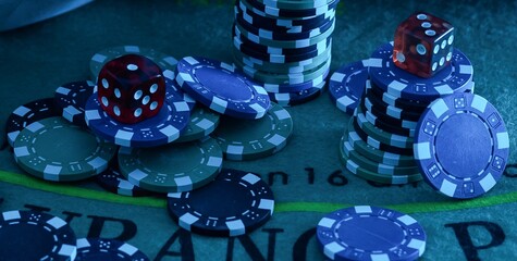 Poker chips on bokeh background. Casino theme.