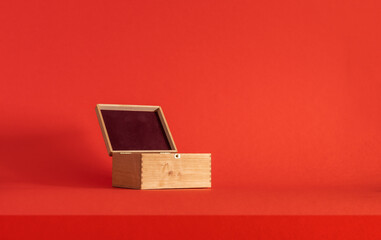 Podium on a red background. Product display. Mockup for product branding, presentation. Background for products, cosmetics, jewelry.