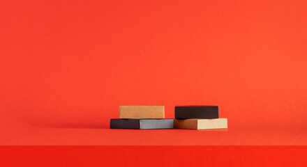 Podium on a red background. Product display. Mockup for product branding, presentation. Background for products, cosmetics, jewelry.