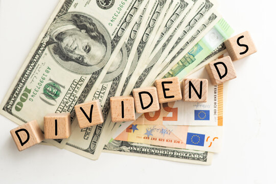 US Dollars with dividend written on it