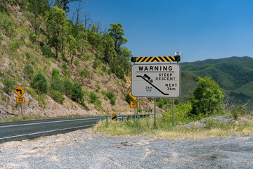Warning steep descent sign in rural Australia