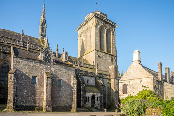Fototapeta na wymiar View at the Church of Saint Ronan in the streets of Locronan in France