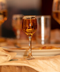 Close up of glasses of wine and snacks on the table