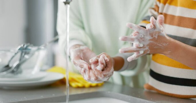 Foam, washing and hands with kid or parent for learning about bacteria or germs in kitchen. Teaching, child and woman with soap or water for skincare with stop dirt or virus for wellness in home.