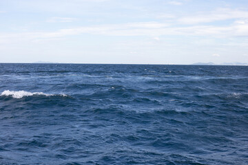 Naklejka premium Blue sea water surface texture. Blue ocean summer
