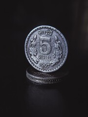 coins on black background