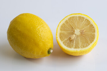 Ripe lemons on white background.