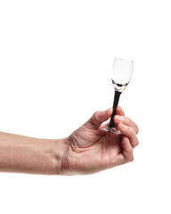 Men's hand holding empty shot glass isolated on a white background. Concept of alcohol, drink, party, degustation, holiday