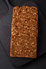 Delicious fresh crispy brown bread with seeds and grains cut into slices