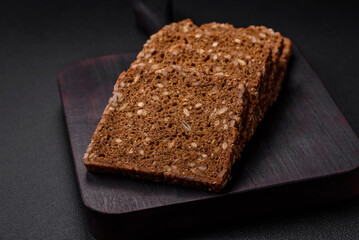 Delicious fresh crispy brown bread with seeds and grains cut into slices