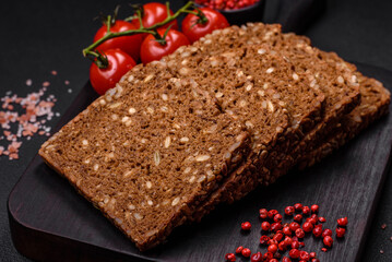 Delicious fresh crispy brown bread with seeds and grains cut into slices