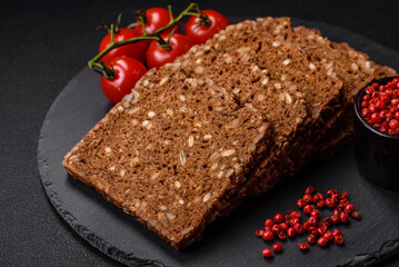 Delicious fresh crispy brown bread with seeds and grains cut into slices