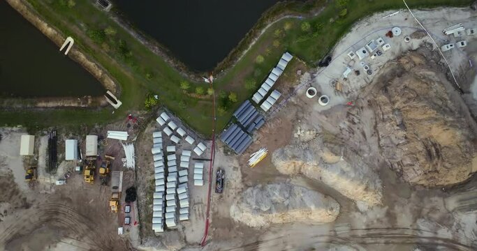 Beginning of construction works on prepared ground. Large building site with scattered equipment in american rural area. Development of residential housing in US suburbs. Real estate market in USA