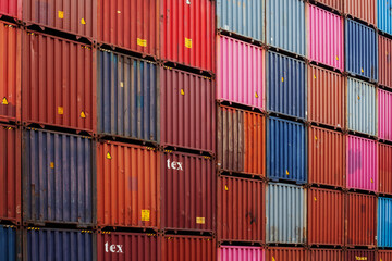 Container yard for Logistic Import Export business, vintage colorful container stack look. pastel...