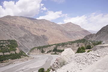 Barren mountain landscapes, white clouds and blue skies
The stark beauty of barren mountain landscapes with this captivating image. 