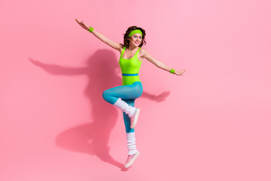 Photo of sportive lady trainer jump up practice pilates gymnastics isolated over pastel color background