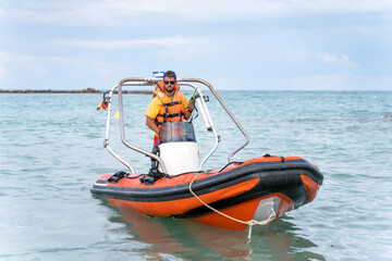 Lifeguard on a boat in the middle of the sea