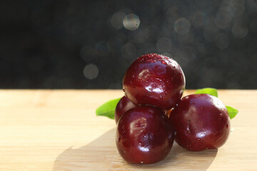 cherries on wooden table, fresh fruit