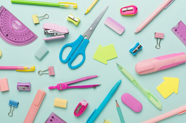 Flat lay with colorful school stationery on color backgroung, top view