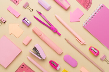 Pattern with pink school stationery on color backgroung, top view