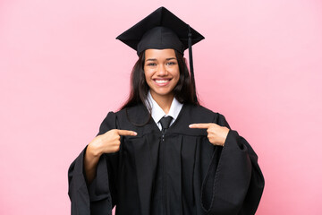 Young university Colombian woman graduate isolated on pink background proud and self-satisfied