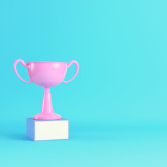 Trophy cup on bright blue background in pastel colors. Minimalism concept