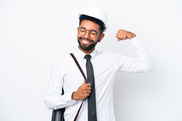 Young architect Brazilian man with helmet and holding blueprints isolated on white background doing strong gesture