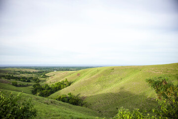 Fototapeta na wymiar Ledongara hills, showing hills with green field in Sumba, East Nusa Tenggara, Indonesia