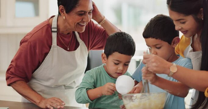 High five, help and children baking with family, learning and support for mixing ingredients. Smile, success and excited grandmother with a gesture for a kid while cooking with mother in the kitchen