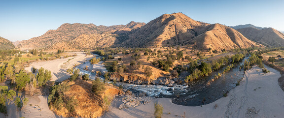 Aerial view of Scenic Valley landscape in California, USA. Winding river through the valley.
Calm waters flow peacefully through a valley in the California river canyon. Sunny weather in summer time.