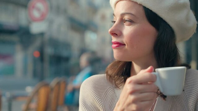 Young woman with a cup of coffee in a cafe in Paris