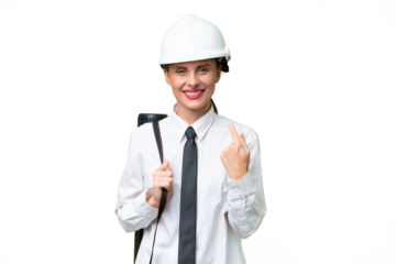Young architect woman with helmet and holding blueprints over isolated background giving a thumbs up gesture