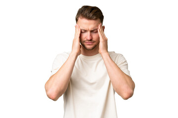 Young blonde caucasian man over isolated background with headache