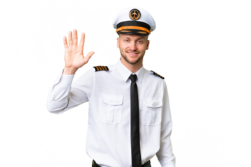 Airplane pilot man over isolated background saluting with hand with happy expression