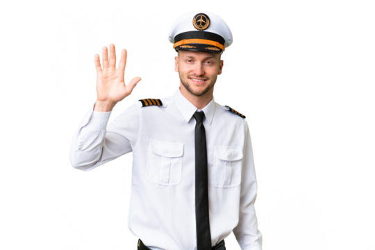Airplane pilot man over isolated background saluting with hand with happy expression