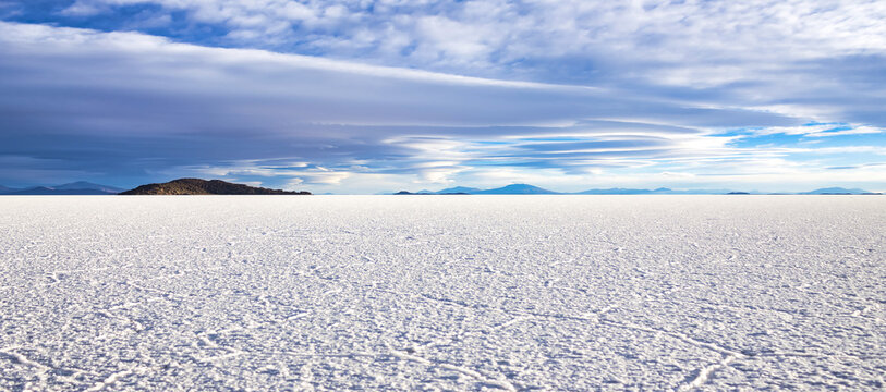 Panoramic landscape photo of wild nature salt flat with mountains, backgrounds. Scenery view of Bolivia natural salt desert wilderness, no people. Bolivian landmarks concept. Copy ad text space